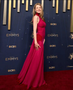 Hunter Schafer at the 2025 Emmys wearing a vibrant strawberry-blonde hair colour that glows under the red carpet lights — a soft, feminine shade perfect for the season, styled with expert hair colour care from the best salon in North Sydney.