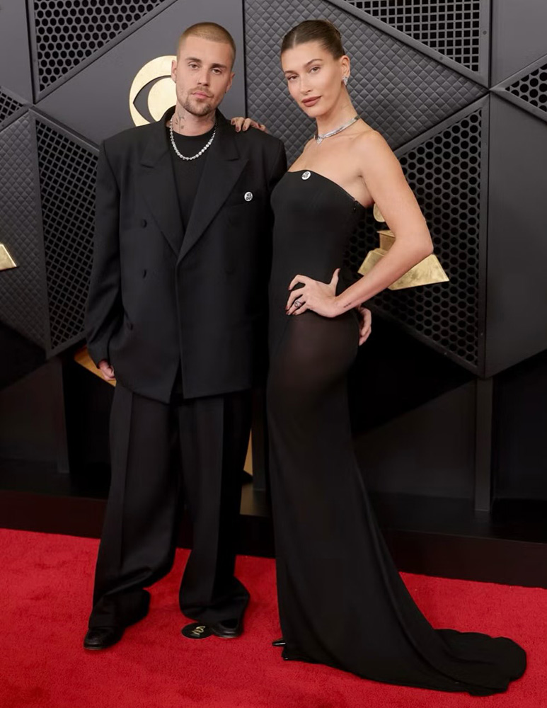 Hailey Bieber at the 2026 Grammy Awards wearing sleek straight glossy hair, showcasing the polished red carpet hair trend.